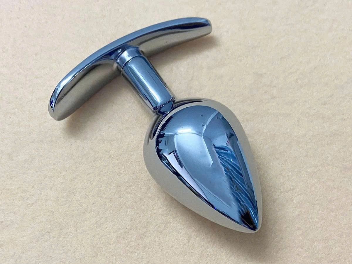 Dụng cụ kích thích h&acirc;̣u m&ocirc;n inox c&oacute; tay cầm